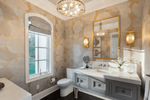 a dimly lit elegant bathroom with custom cabinetry and craftsmanship