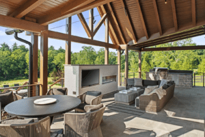 an outdoor space with high ceilings and outdoor lounge furniture